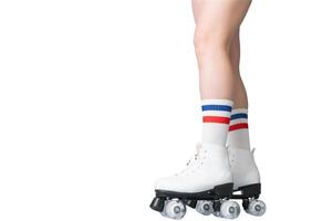 Close-up of caucasian female in roller skates with white socks and striped pattern photo