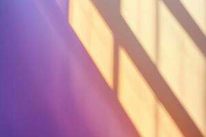 Blurred window sunlight creates abstract shadow pattern on purple wall photo