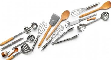 Kitchen Utensils Composition Whisks, Spoons, and Tongs on a White Background photo