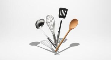 Kitchen Utensils Ladle, Whisk, Spatula, and Wooden Spoon on White Background with Shadows photo