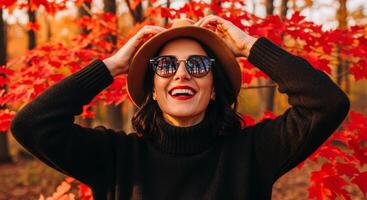 Joyful Autumn Woman Smiling in Fall Foliage with Reflected Trees photo