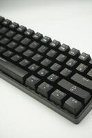 Mechanical keyboard with a 61 layout in black from the top with a white background photo