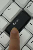 The black enter key on a mechanical keyboard with a monochrome theme photo