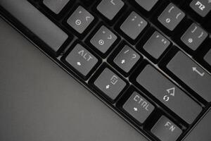 Arrow keys on a black mechanical keyboard with a black background photo