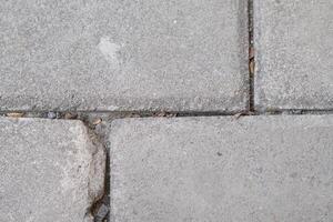 A background of grey paving blocks with lines photo