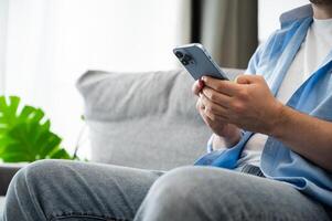 Modern technologies concept with young men using phone to send messages,surf internet photo