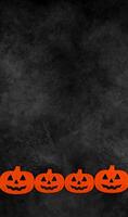 Vertical banner with pumpkins at bottom border against dark mystery concrete background. Halloween flat lay with place for text. Card or invitation for october 31. photo