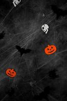 Top view on dark halloween background with bats,spiders,skulls and spider web.Vertical banner photo