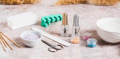 Set of tools for manicure and pedicure on the table web banner photo