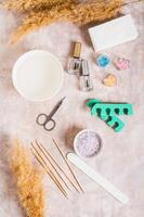 Set of items for manicure and pedicure on the table top and vertical view photo