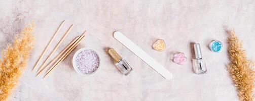 Set of items for manicure and pedicure on the table top view web banner photo