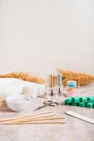Set of items for manicure and pedicure on the workplace vertical view photo
