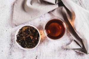 Close up of Earl Grey tea with bergamot in a cup on table top view photo