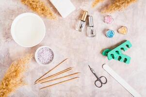 Set of items for manicure and pedicure on the table top view photo