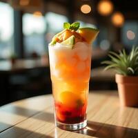 Refreshing Tropical Drink with Fruit and Ice on Table photo