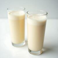 Serving Glass of Creamy Beverage Refreshment on White Surface photo