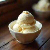 Serving Vanilla Ice Cream Scoops in Bowl on Wooden Table photo