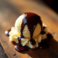 Ice Cream Scoop with Chocolate Sauce Flowing on Top photo
