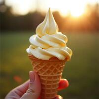 Holding Vanilla Soft Serve Ice Cream Cone at Sunset photo