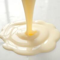 Pouring Creamy Liquid Creates a Smooth Swirl Design photo