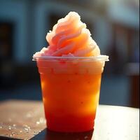 Refreshing Frozen Drink with Swirl Topping in Clear Cup photo