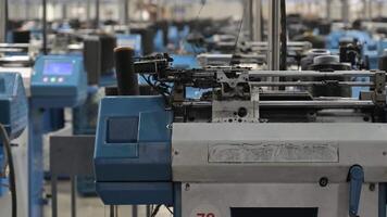 Automated working textile production machines in a factory. video