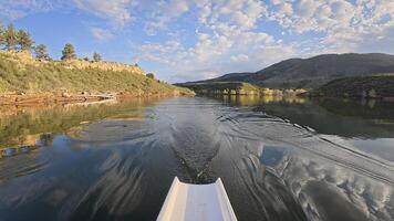 rowing scenery from a calm lake at foothills of Colorado Rocky Mountains - rower POV view photo