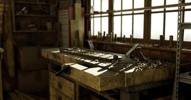 CGI Crafting tools in a well lit woodworking shop filled with sawdust video