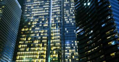 CGI City skyscrapers illuminated at night showcasing urban architecture video