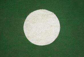 withe round on green texture background photo