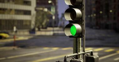CGI Traffic lights at a quiet intersection in an urban setting during dawn video