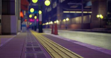 CGI Nighttime city street with colorful lighting and empty sidewalks video
