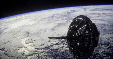 CGI Satellite structure orbiting Earth above the cloud cover during daylight hours video