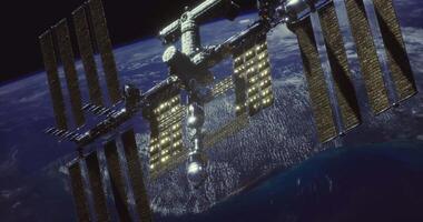 CGI A large space station floats above Earth, illuminated by sunlight video