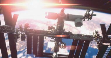 CGI Space station orbits Earth during sunrise with vibrant colors in the background video