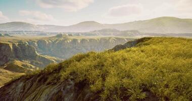 CGI Scenic landscape with rolling hills and vibrant grass under soft sunlight video