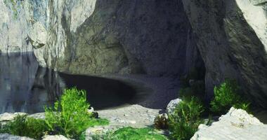 CGI Calm waters and serene cliffs in a hidden beach cove during daylight video