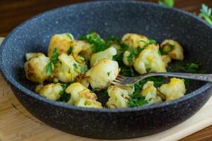 Top view of crispy cauliflower with parsley . photo