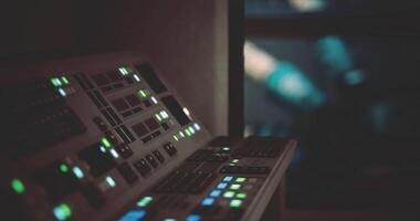 CGI Control panel with illuminated buttons in a darkened space station setting video