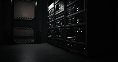 CGI Dark server room with illuminated equipment and shadowy corners at night video
