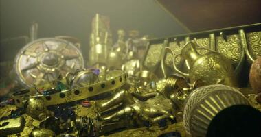 CGI Treasure chest filled with gold artifacts and gemstones in a dim location video