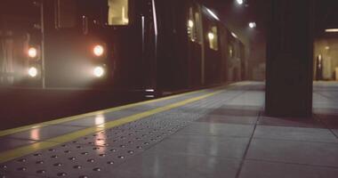 CGI Subway train arriving at a dimly lit platform during late evening hours video