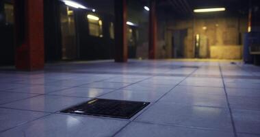 CGI Subway station floor with a drain in the foreground during nighttime video