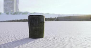 CGI Trash bin stands alone on a deserted beach during golden hour video