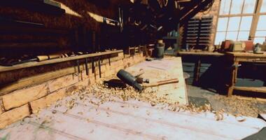 CGI Woodworking tools and shavings in a rustic workshop at midday video