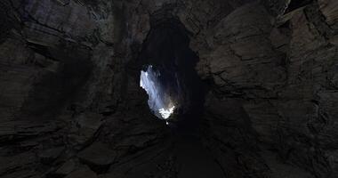 CGI Dramatic light breaking through a cave opening at dusk in a secluded location video