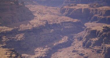 CGI Exploring rugged terrain in a vast canyon landscape during a sunny day video