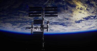 The concept of Art CGI View of the International Space Station against the backdrop of Earth video