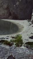 CGI beach coast of the Norwegian Sea with mountains and cliffs on sunny day video