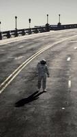 The concept CGI astronaut walks in the middle of a road video